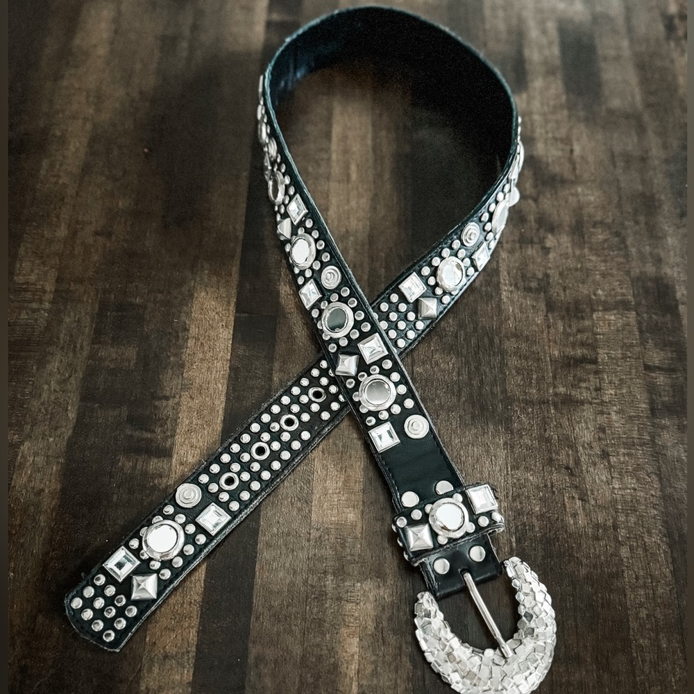 Black leather studded jeweled belt.
